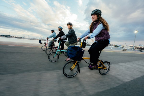 People riding Brompton bikes