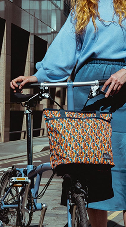a model with the Brompton backpack made with Liberty Fabric