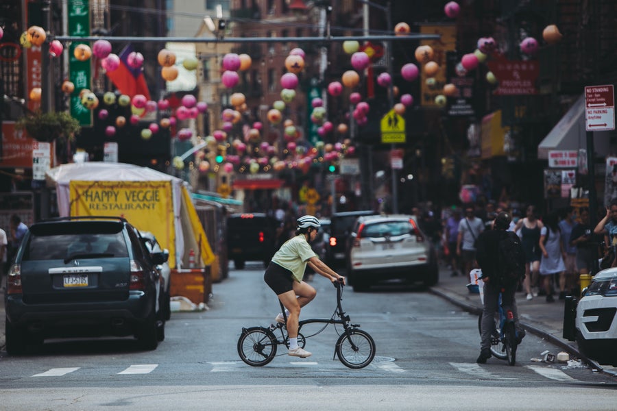 Woman riding Brompton bike in New York