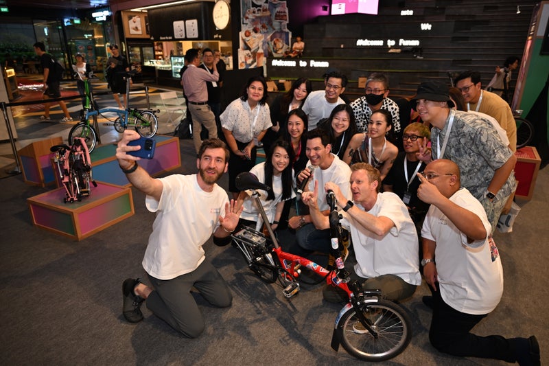 singapore team posing for photo for brompton one millionth journey