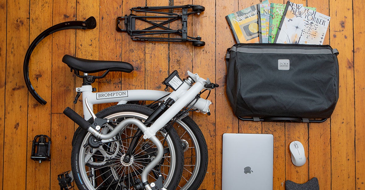 Brompton and accessories flat laid on table