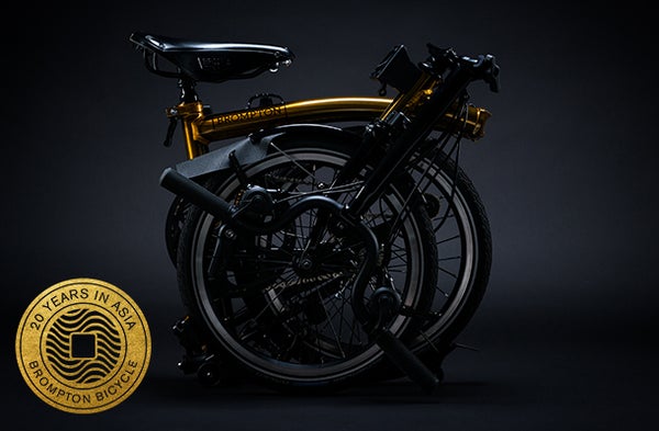 A studio image of the Gold Edition Brompton