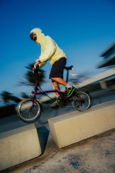 Person riding Brompton bike