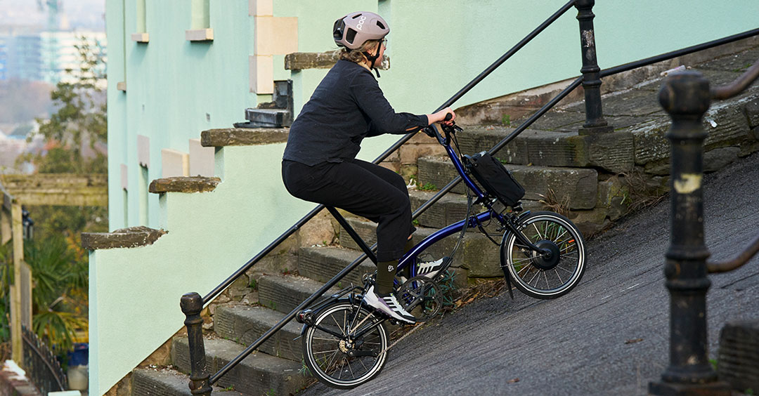 Woman riding Brompton