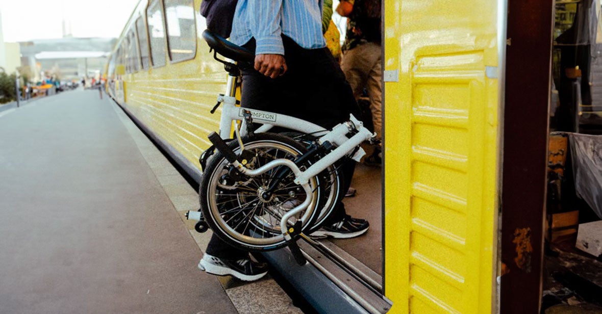 Brompton being carried onto a train
