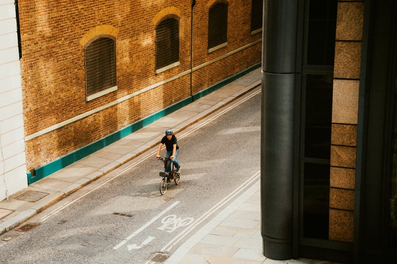 Person riding the 1975 Edition bike on the road