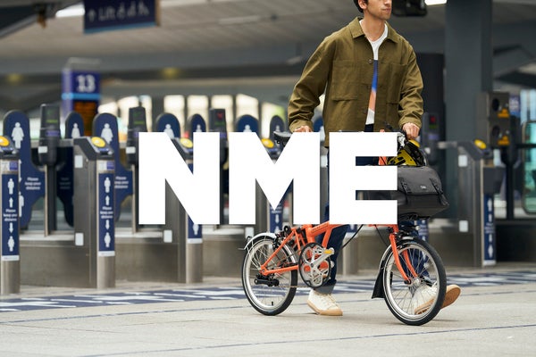 nme logo in white over Brompton bicycle