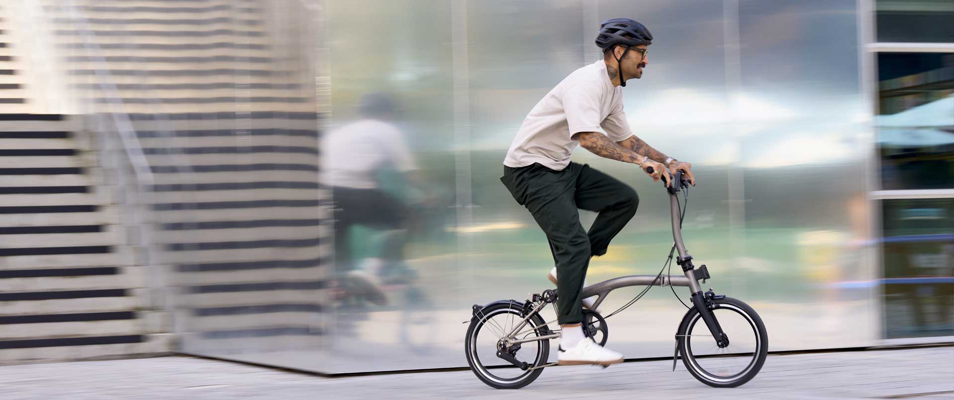 Man riding Brompton bike