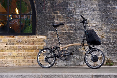 brompton electric bronze sky leaning against a wall