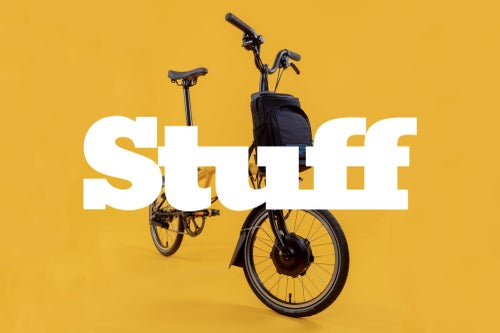 stuff logo over image of brompton bike in bumblebee yellow