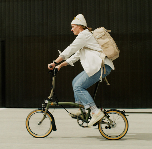 Clara Johanna riding her Brompton x Bear Grylls folding bike
