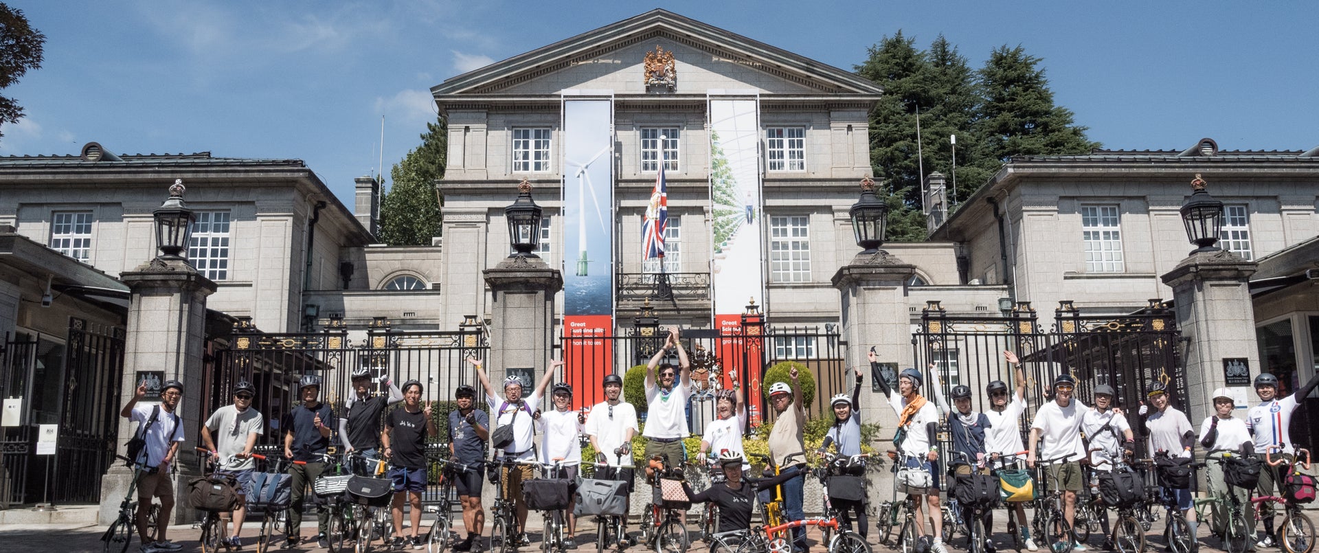 The Japanese Brompton community posing in front of the British Embassy in Tokyo, Japan