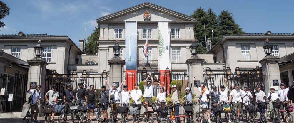 The Brompton Japan community posing outside of the British Embassy in Tokyo after a ride out for the One Millionth Brompton celebration