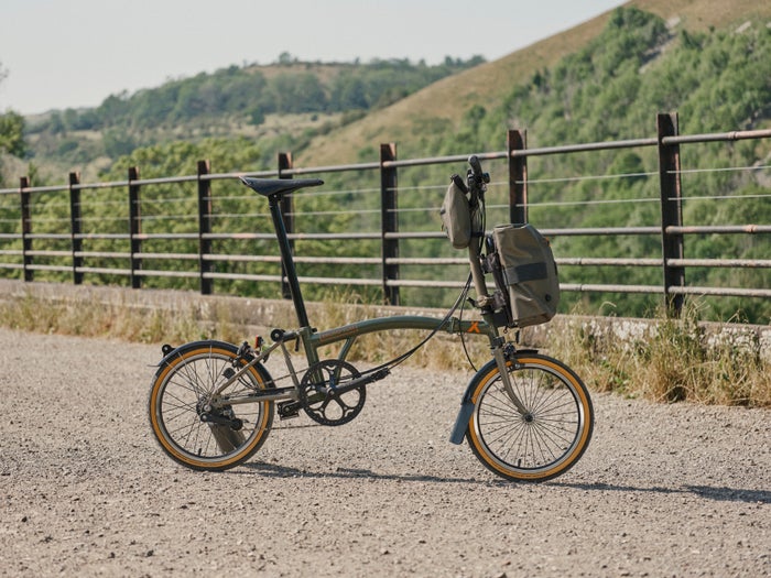 an image of the Bear Grylls Brompton bike in the English countryside