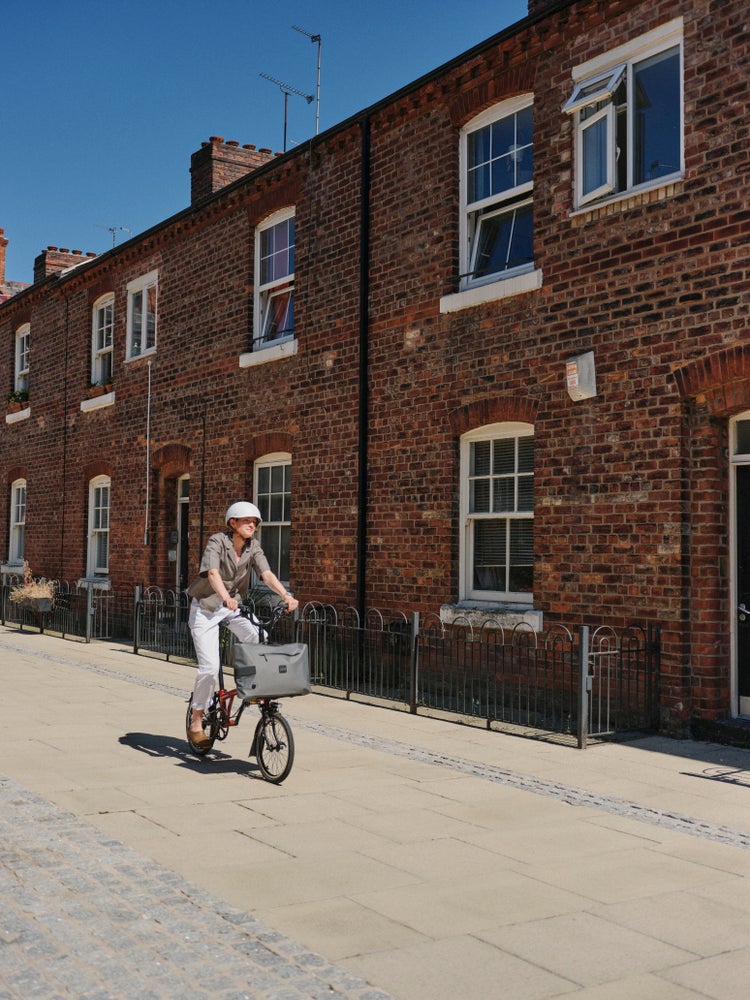 person riding brompton bike in manchester