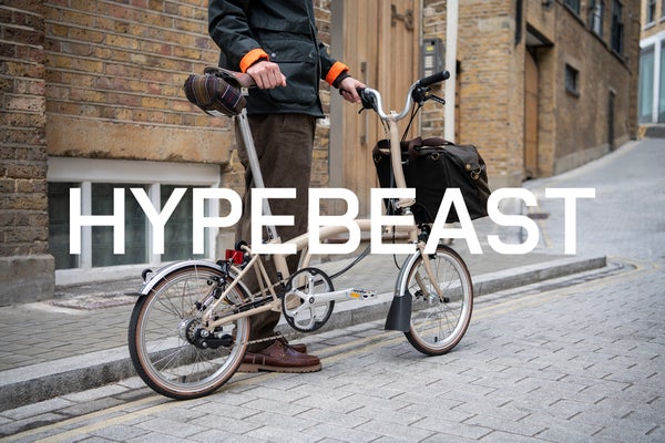 hypebeast logo in white over Brompton bicycle