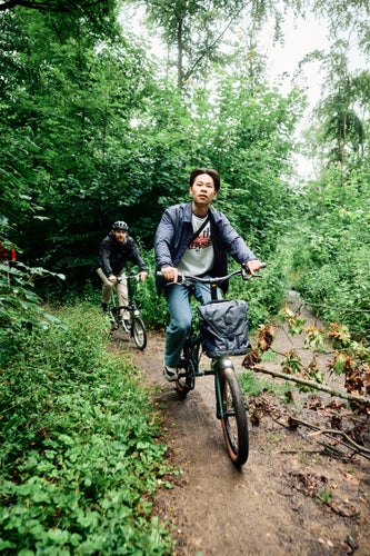 Person riding G Line bike on trail path