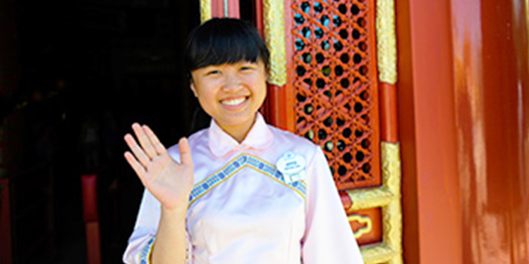 Cast member standing in EPCOT's China Pavilion at Walt Disney World.