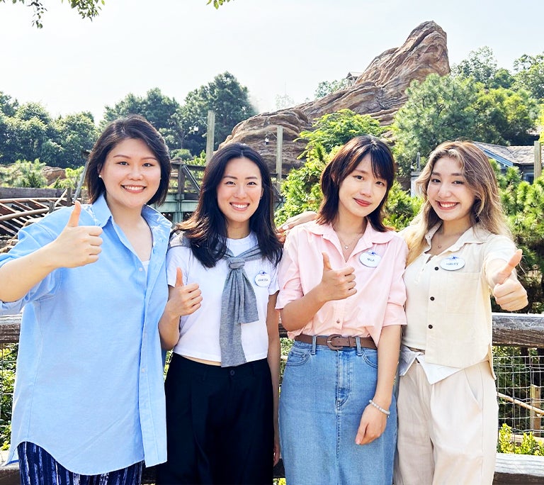 Four interns smiling at Hong Kong Disneyland Resort