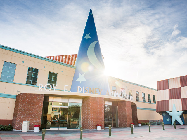The Walt Disney Animation Studios building facade with a Sorcerer Hat illuminated by bright sunlight