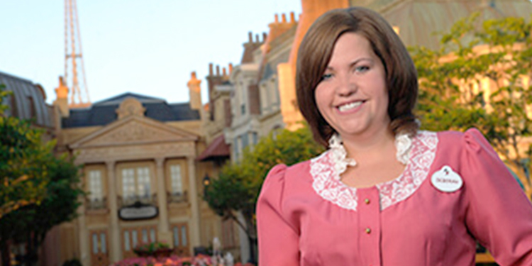 Cast member standing in EPCOT's France Pavilion at Walt Disney World.