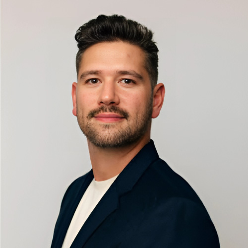 A professional man poses for a headshot