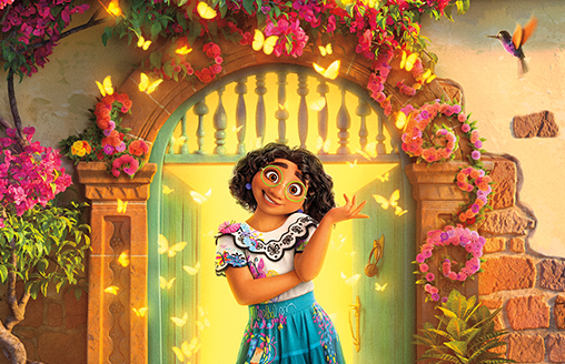 Mirabel from Disney's Encanto smiling in front of Casita from the movie