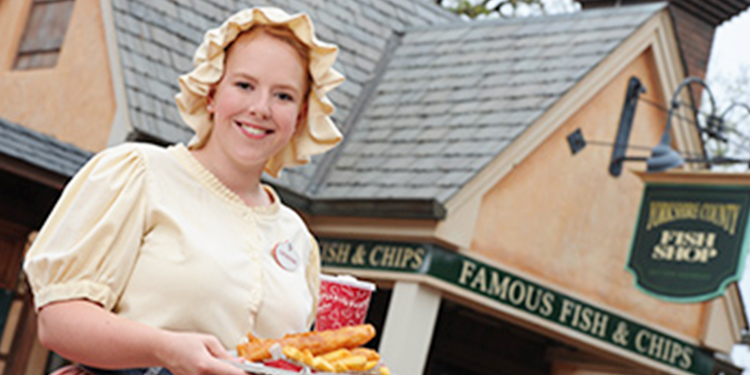 Cast member standing in EPCOT's United Kingdom Pavilion at Walt Disney World.