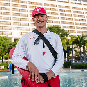Lifeguard smiling in front of Disney's Contemporary Resort.