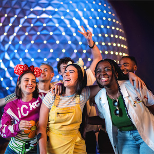 Group of participants gathering for a photo in front of Spaceship Earth at EPCOT
