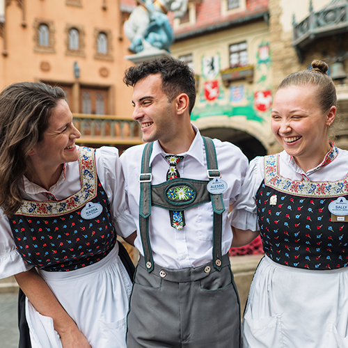 Three cast members smiling at Epcot