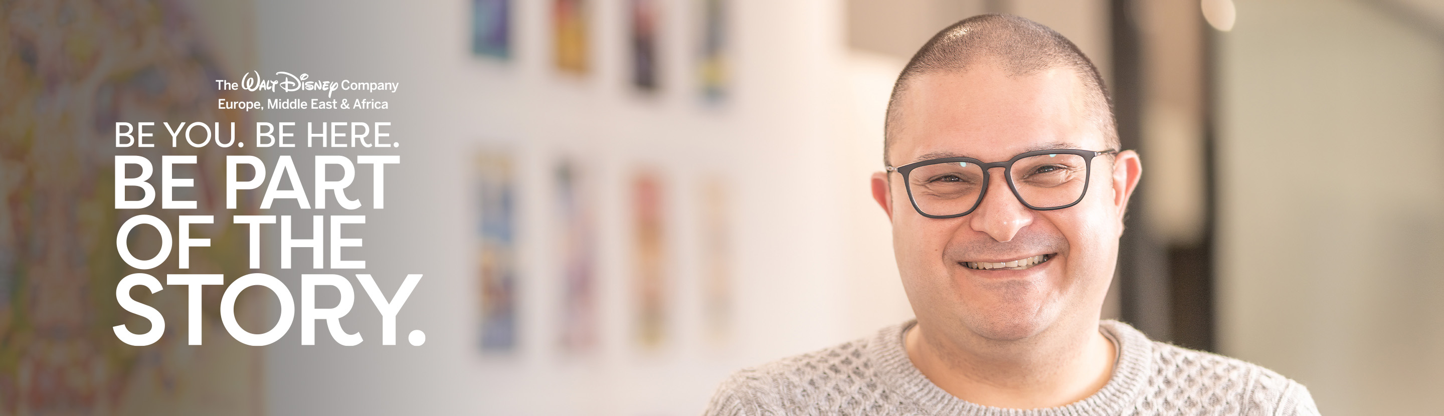 Smiling professional employee in front of a blurred wall