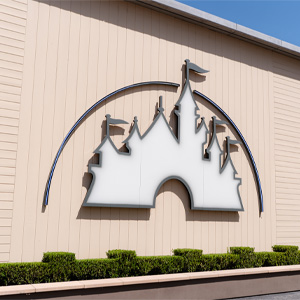 Disney castle silhouette mounted on the exterior wall of a studio building