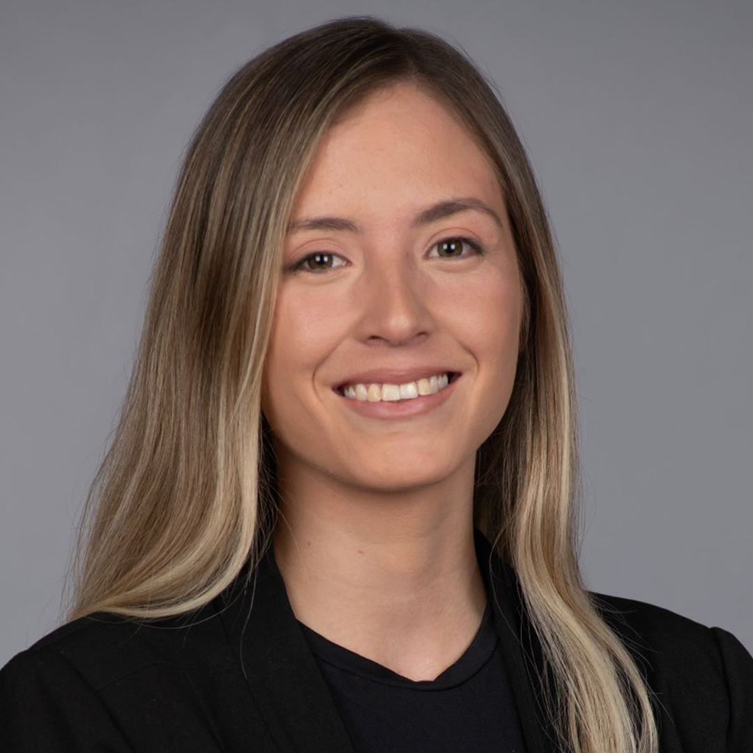 The Walt Disney Company LATAM Recruiter Emiliana wearing a black shirt and smiling with long hair