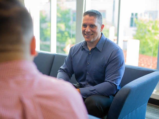 Finance and Accounting professional smiling during a discussion