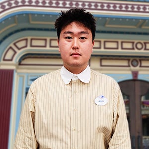 Disney interns Jerry wearing a collared shirt smiling