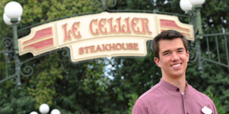 Cast member standing in EPCOT's Canada Pavilion at Walt Disney World.
