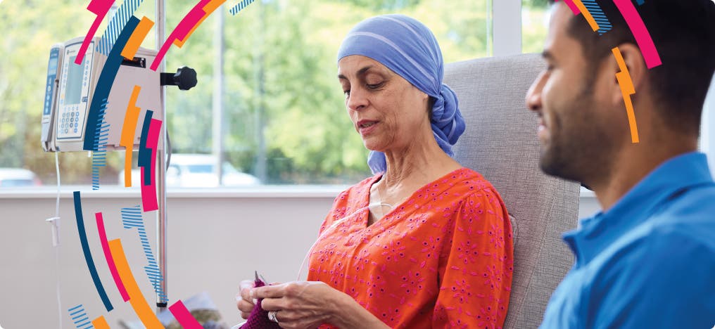 A patient sitting in a doctor's office and knitting while she waits to see the provider
