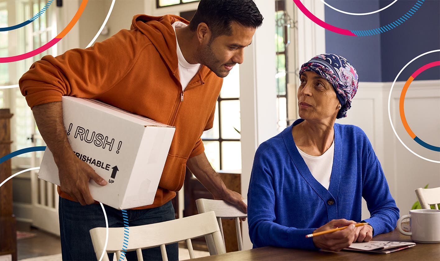 An oncology patient talking with a family member after receiving home delivery of a specialty medication.