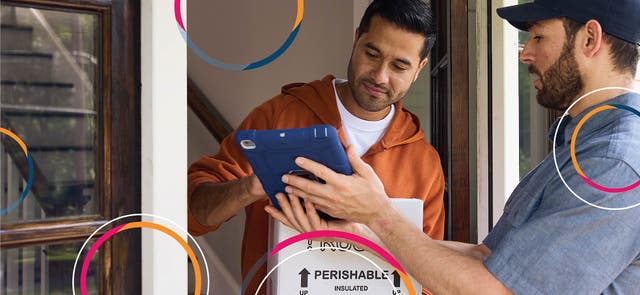 Delivery person asking a patient to sign for their prescription delivery at their door.