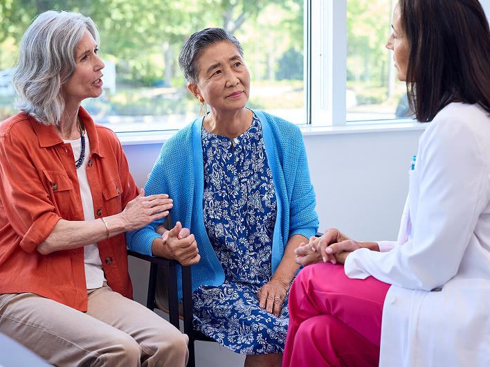 Provider consulting with a patient and their care giver