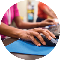 An image of a hand clicking a computer mouse