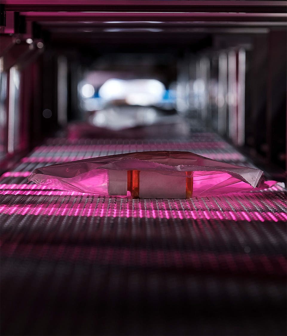 Medication on conveyer belt to be mailed directly to patient