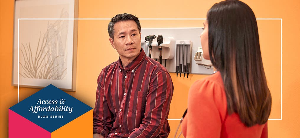 A patient and doctor having a conversation in an exam room