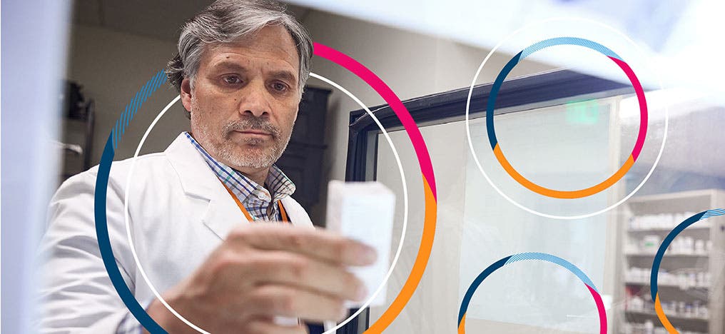 A photo of a health care provider looking at a slip of paper