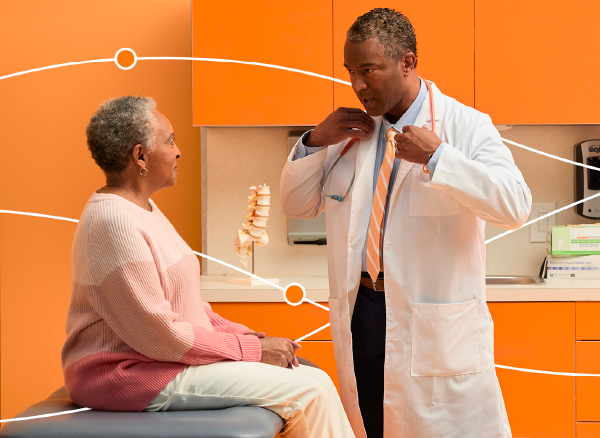 An image of a doctor consulting a patient in the exam room