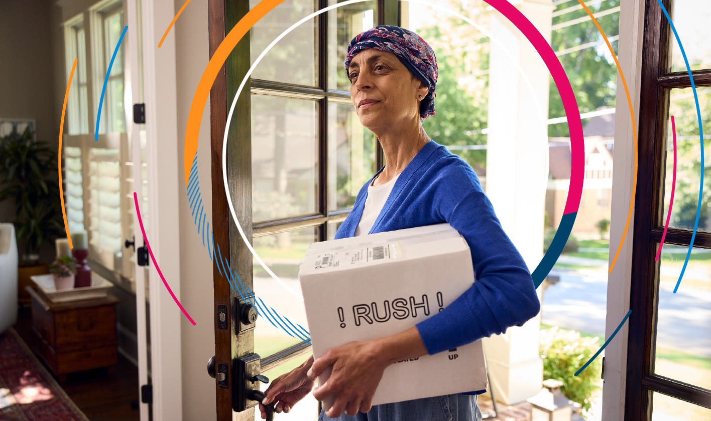 Patient carries a delivered specialty medication into her home