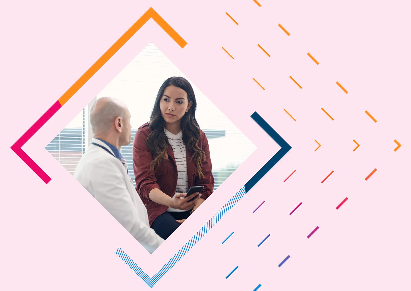 A provider and a patient speaking in an exam room