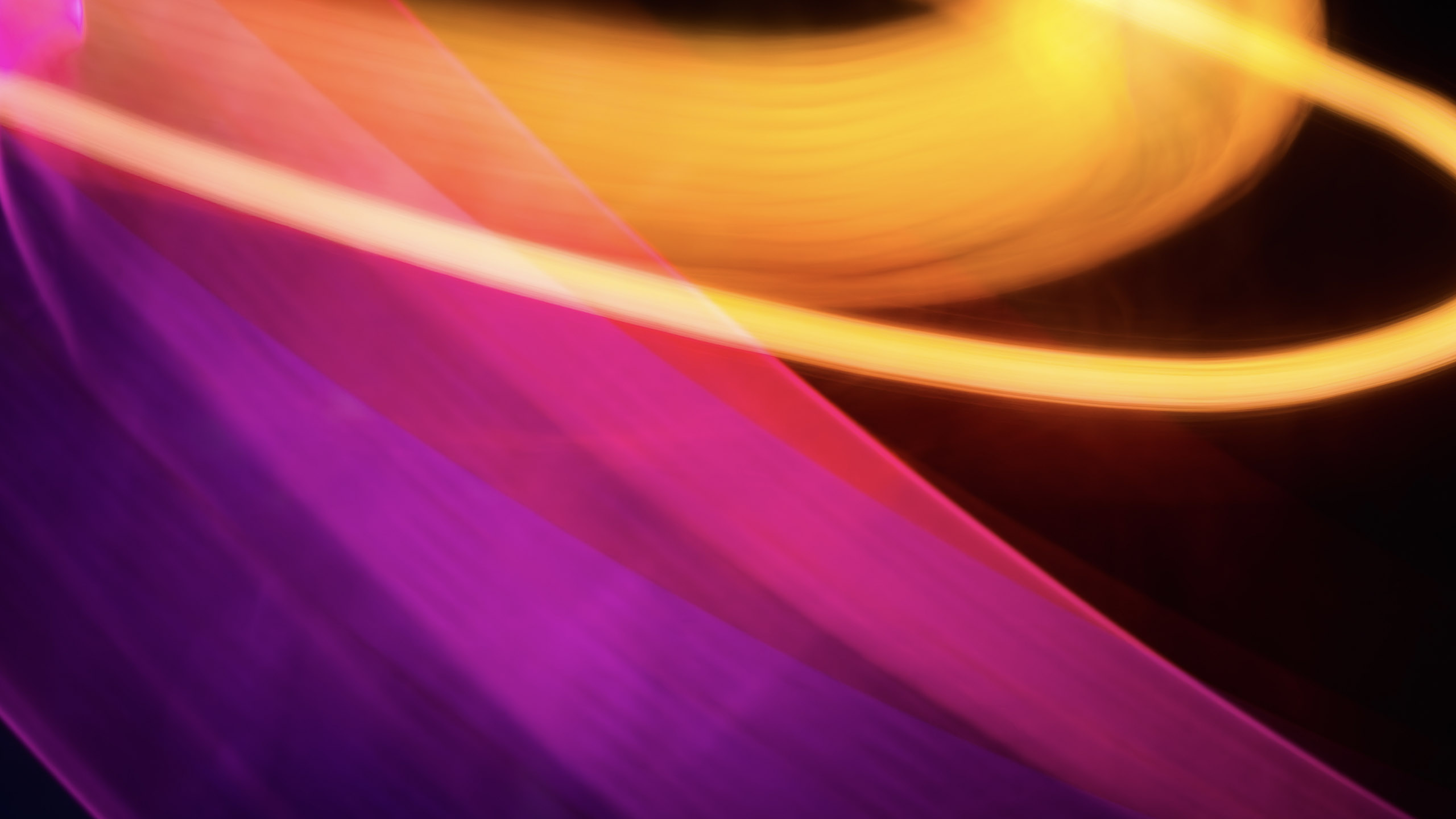 Colorful_swirl_of_pink_and_orange_with_a_black_background_PPT.jpg